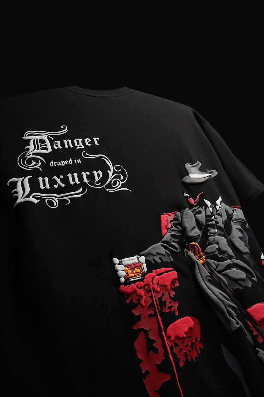 DANGER DRAPED IN LUXURY TEE